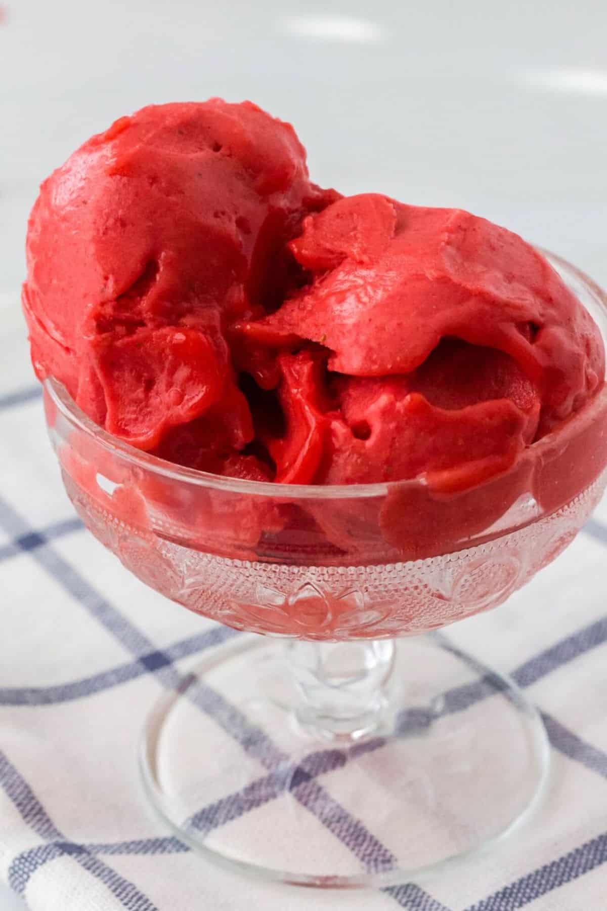 Easy Ninja Creami Strawberry Sorbet in a tall glass cup.