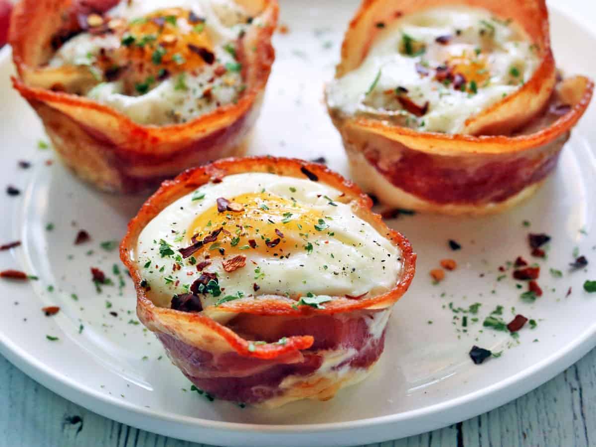 Three Bacon Egg Cups on a white plate.