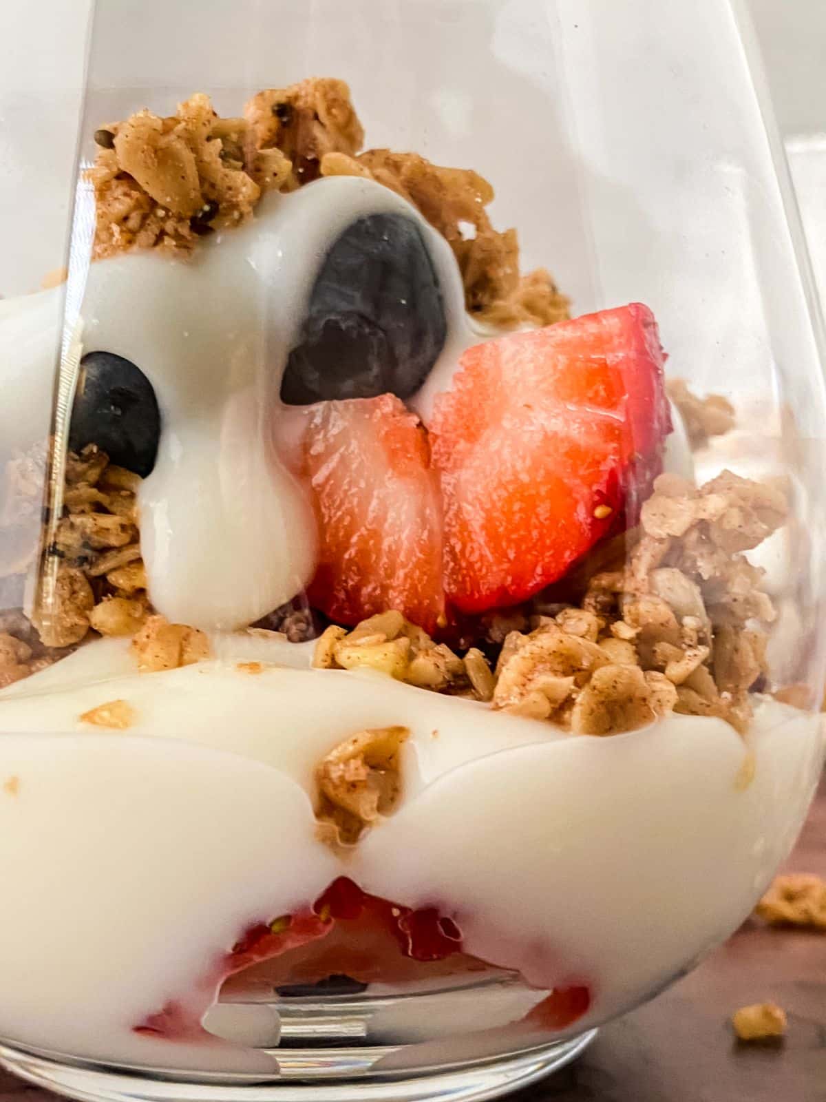 glass of yogurt with strawberries and blueberries
